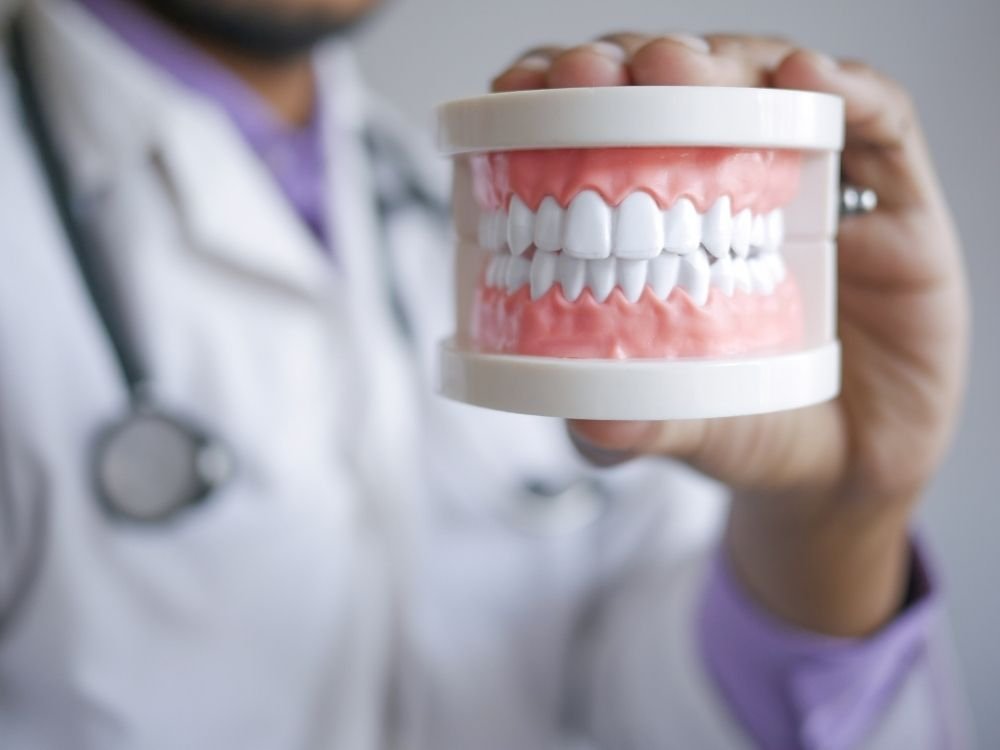 Illustrative clinician explaining a dental image to a patient